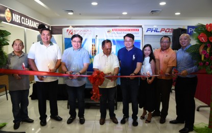 <p><strong>NBI SATELLITE CLEARANCE OFFICE -</strong> National Bureau of Investigation (NBI) Director Atty Dante Gierran (center), GenTri Mayor Antonio 'Ony' Ferrer (3rd from left) and Cavite 6th District Congressman Luis 'Jon-Jon' Ferrer IV (4th from right) lead the ribbon cutting ceremony of the newly opened NBI Satellite Clearance center in 3rd Floor, Lingkod Pinoy Center, Robinson's Place, Tejero, General Trias City, Tuesday, July 3, 2018. Also in photo are (from left) Councilor Vivencio Lozares Jr, Vice Mayor Morit Sison, Ms. Maricel Ramirez, Operations Manager, Robinsons Place GenTri, NBI Deputy Director for ICTS Atty. Jose Yap and Mr. Irving Wu, Operations Director for Luzon, Robinson's Land Corp. <em>(Photo by Dennis Abrina/PNA</em>)</p>